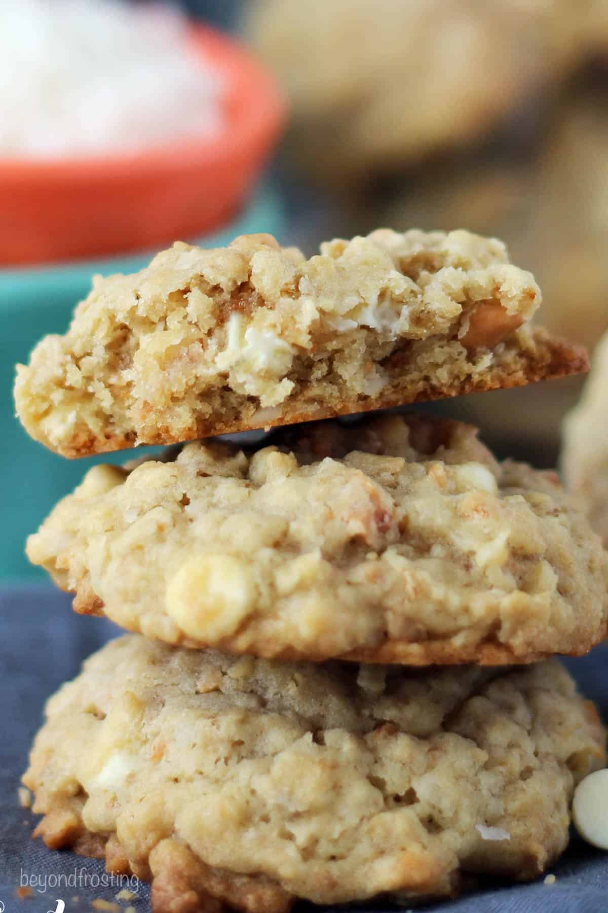 three coconut cashew oatmeal cookies stacked