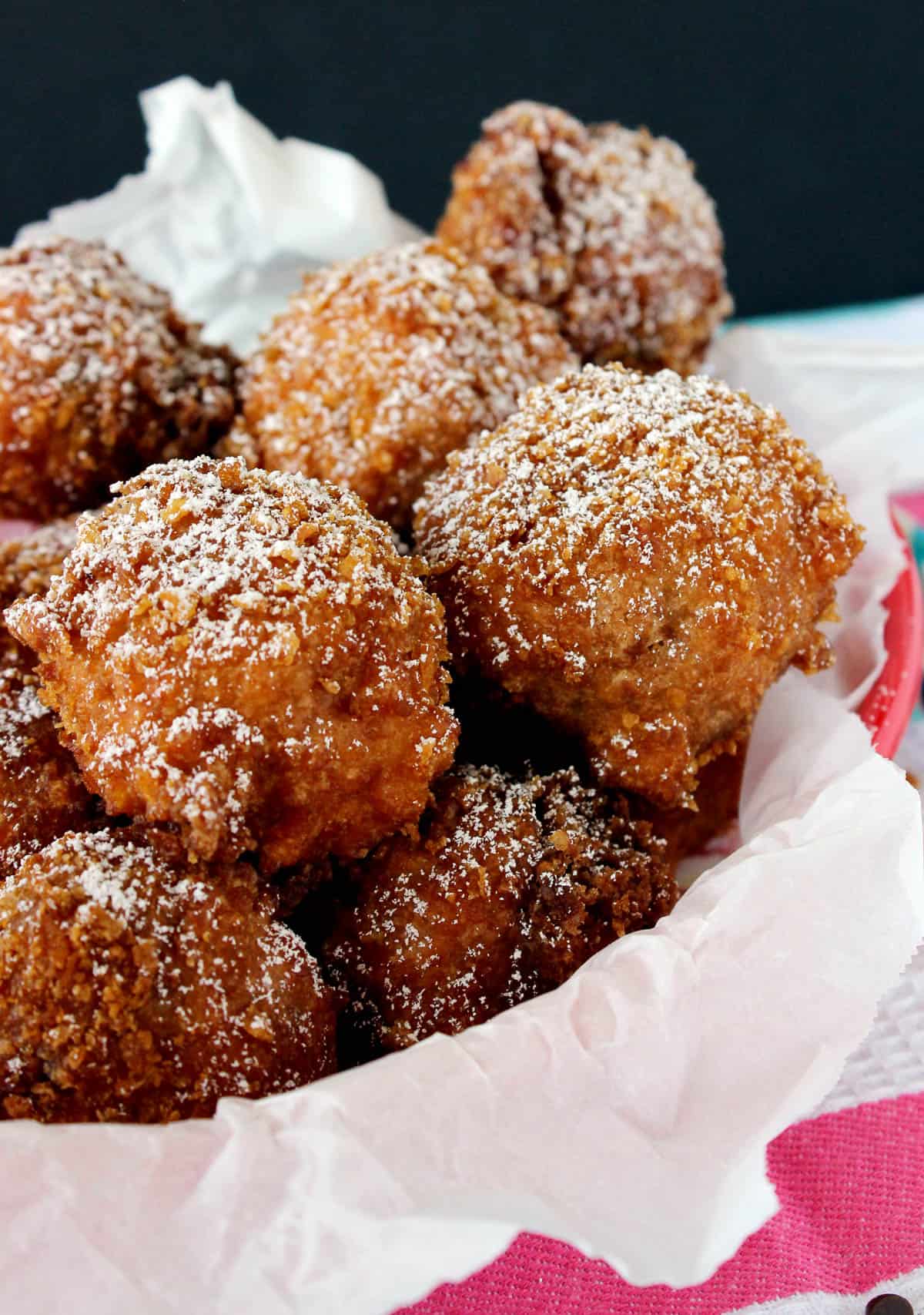 side view of deep fried cookie dough in a basket