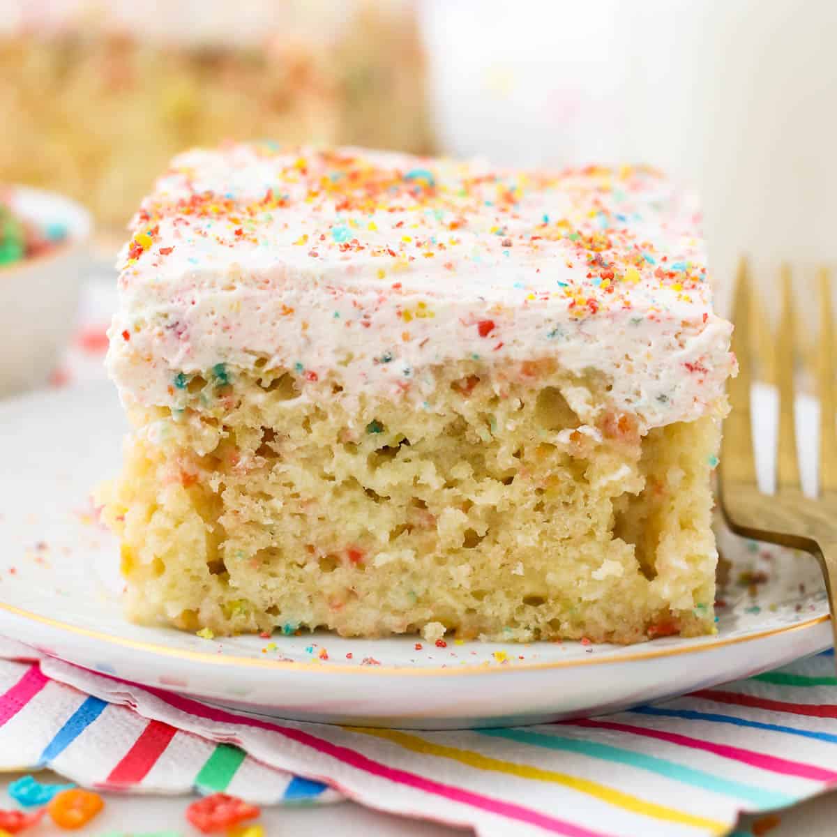 Fruity Pebble Cereal Milk Poke Cake Is Easy To Make & So Delicious!