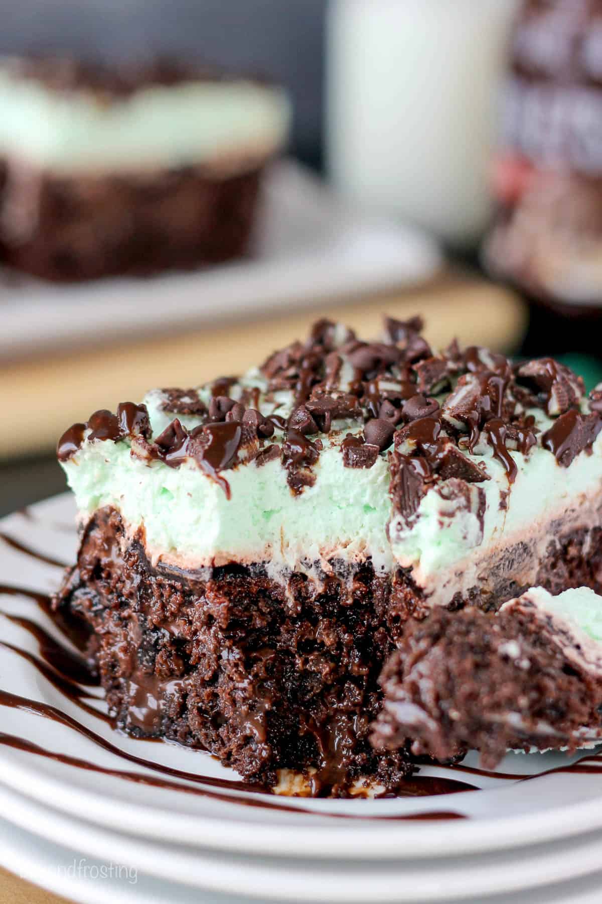 side view of double chocolate poke cake with a bite taken out