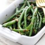 closeup of a baking dish filled with sautéed green beans