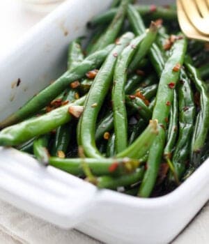 closeup of a baking dish filled with sautéed green beans
