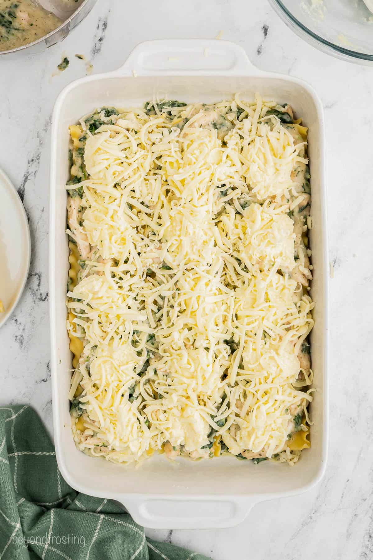 Cheese layered with noodles in a casserole dish