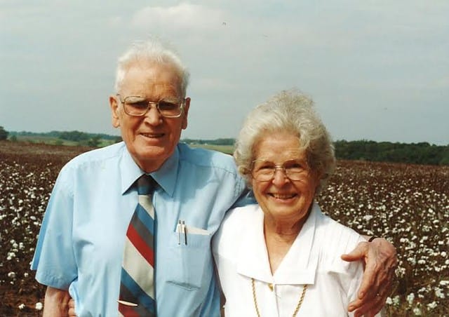 Blog author's grandparents standing in front of a cotton field