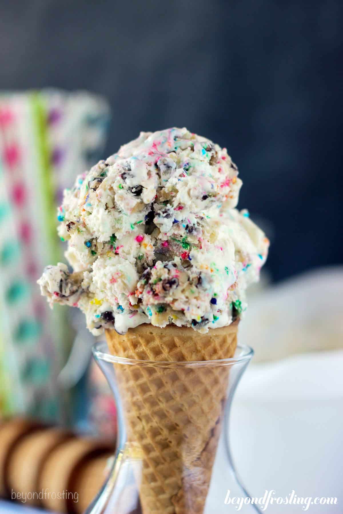 closeup of an ice cream cone filled with cake batter ice cream