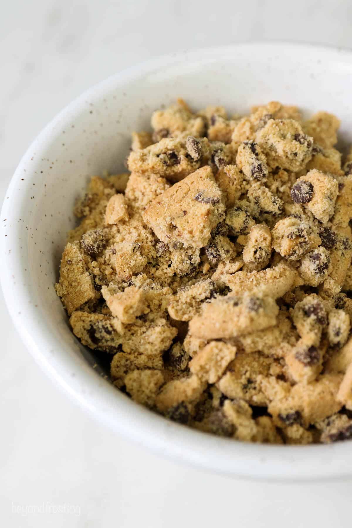 A white bowl of crushed Chips Ahoy Cookies