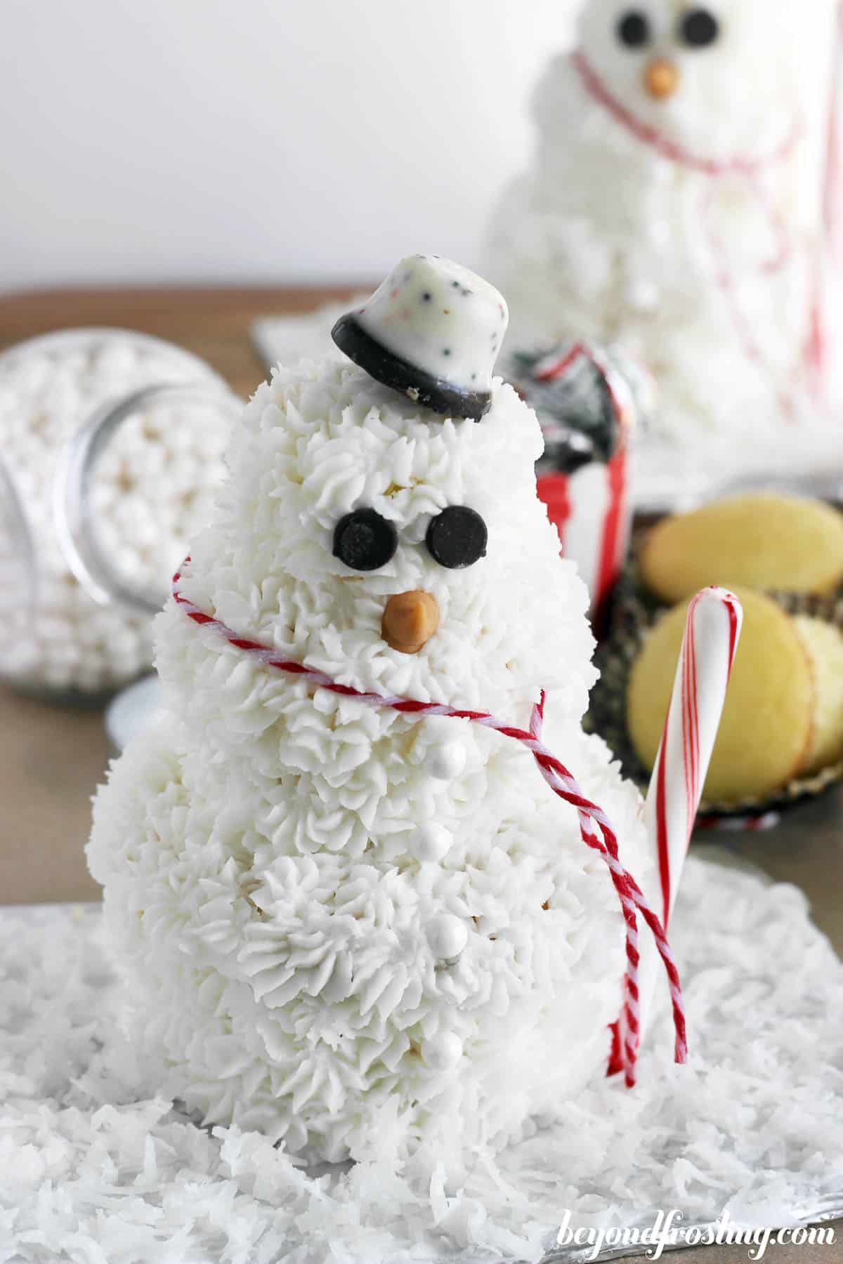 overhead of a cupcake snowman with buttercream frosting