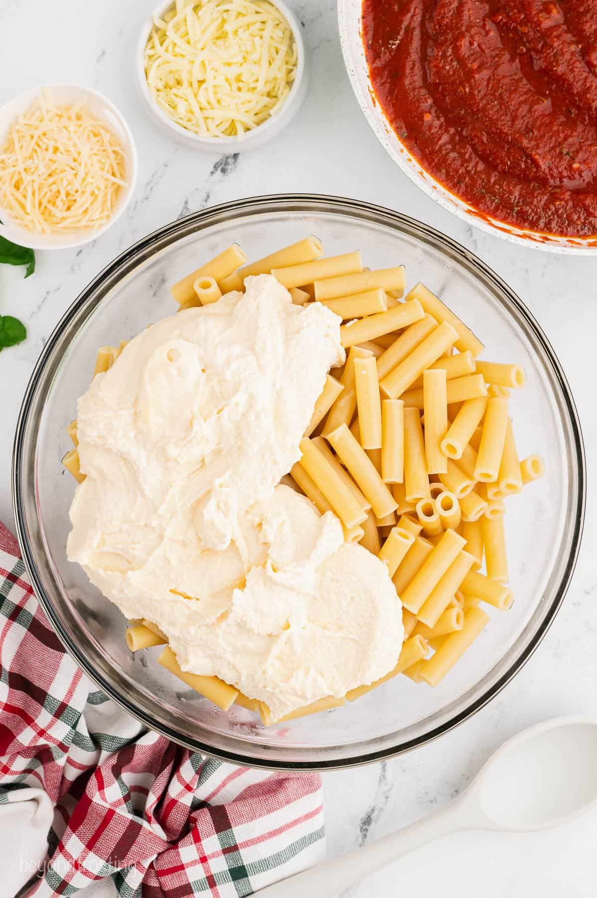 Ziti noodles with ricotta cheese in a bowl
