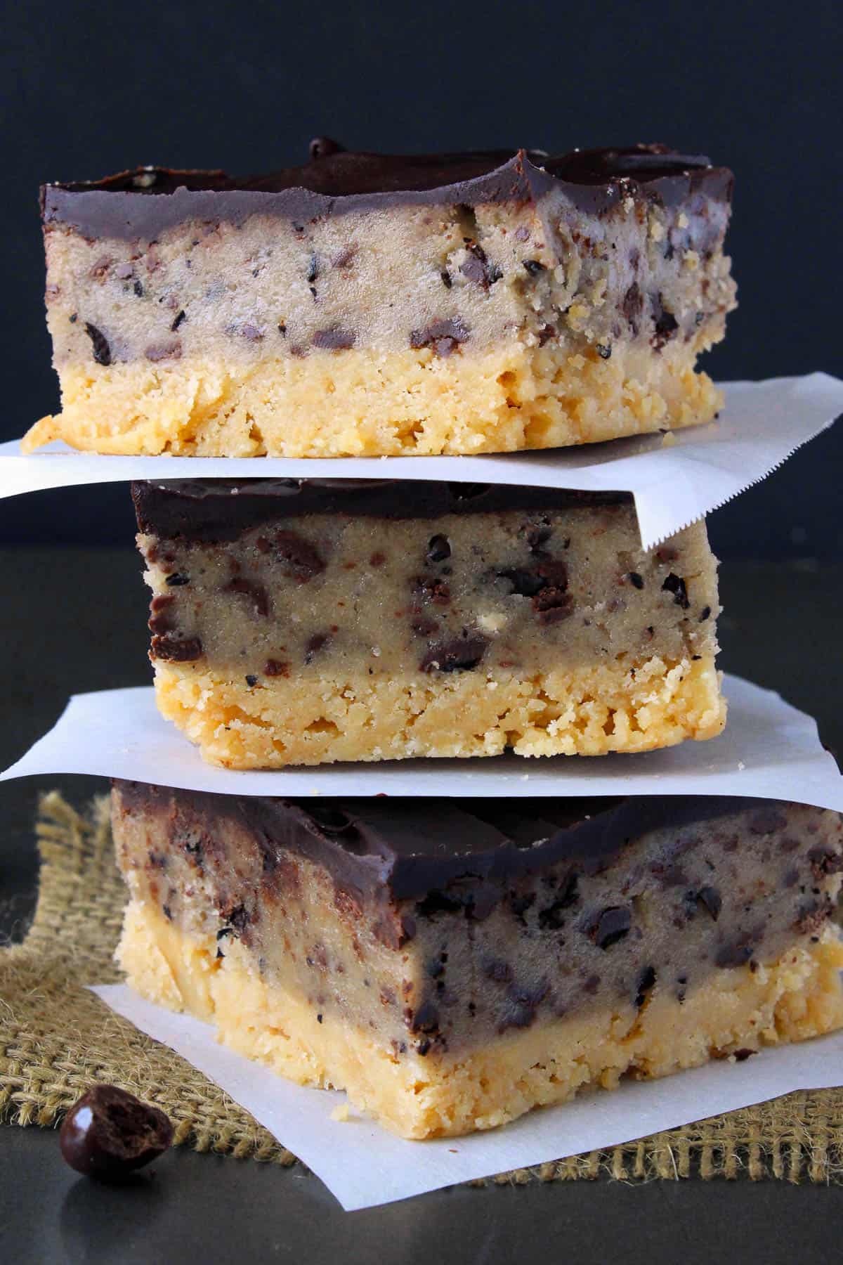 three cookie dough bars stacked on top of one another
