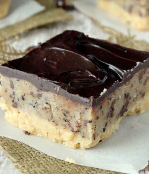 closeup of a cookie dough bar topped with chocolate