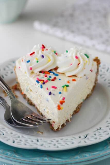overhead of a slice of funfetti cookie dough pie on a white plate