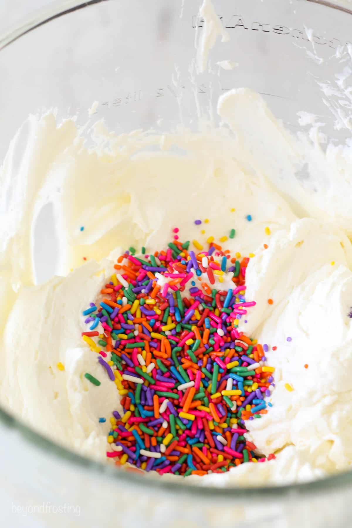 A bowl of whipped cream with sprinkles