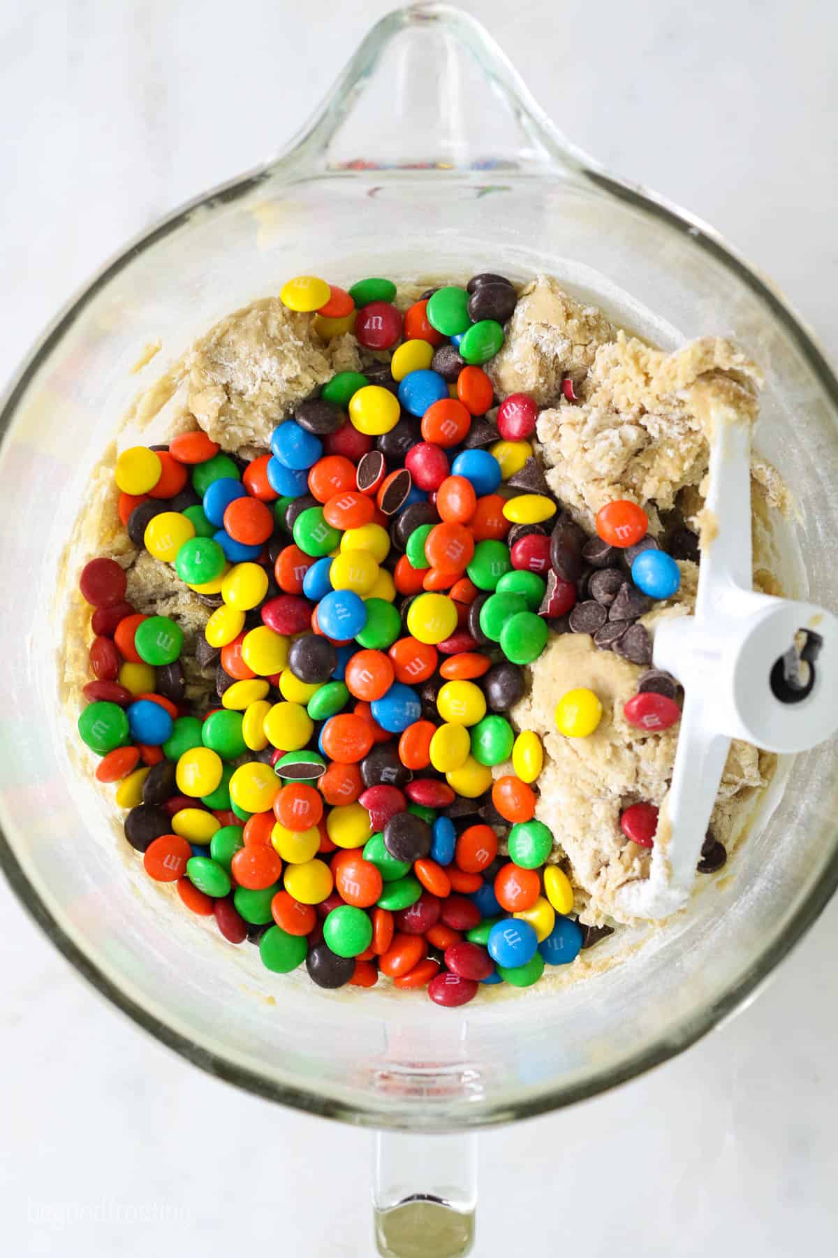 Cookie dough with M&Ms in a mixing bowl