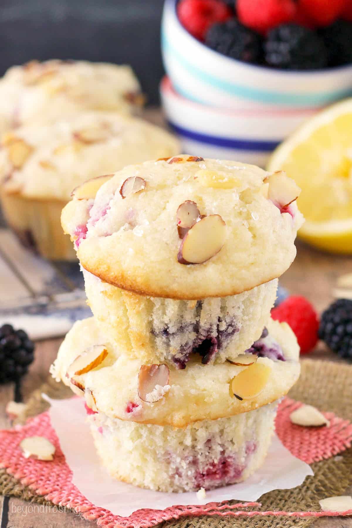 two raspberry muffins stacked