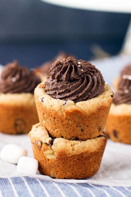 two cookie cups stacked with chocolate frosting on the top