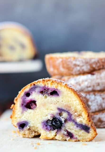 side view of a slice of blueberry bundt cake