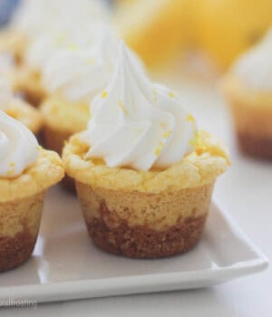 closeup of a frosted lemon cookie cup lined with other cookie cups