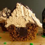 closeup of a cupcake sliced in half to show a chocolate filling
