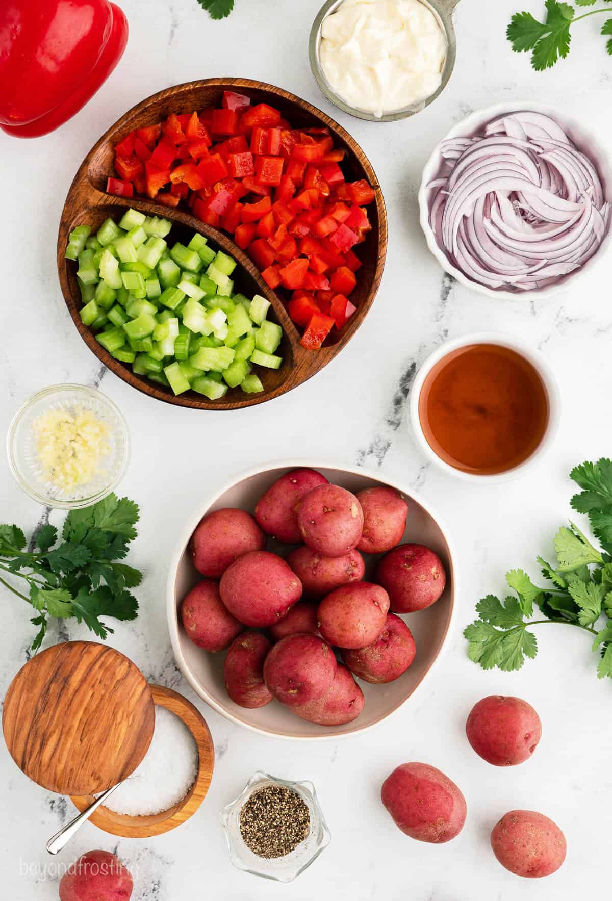 Overhead view of red potato salad ingredients