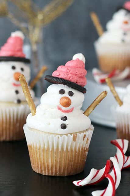 side view of a vanilla cake decorated to look like a snowman