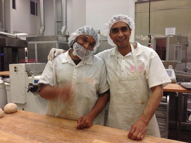 Two workers in hairnets at Homeboy bakery