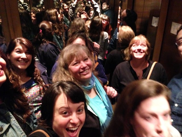 A group of food bloggers in a crowd at Bake for Good event in Seattle