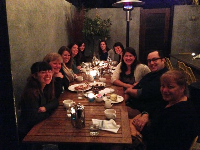 A group of friends dining at a restaurant table