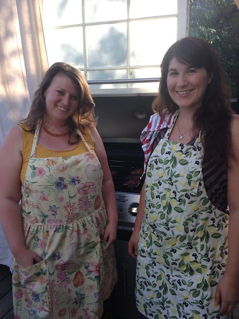 Two food bloggers wearing aprons