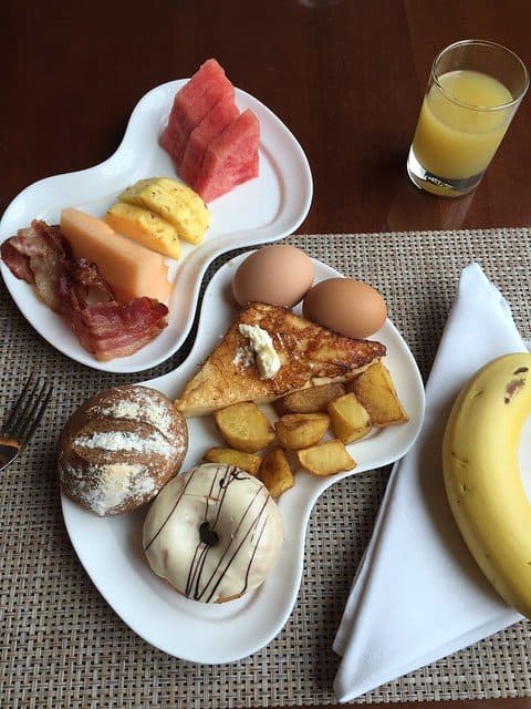 Plates of Western-style breakfast at hotel in Vietnam