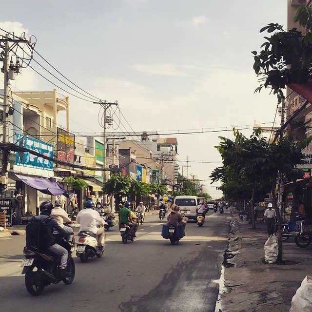 A city street with motorcycle traffic in Vietnam