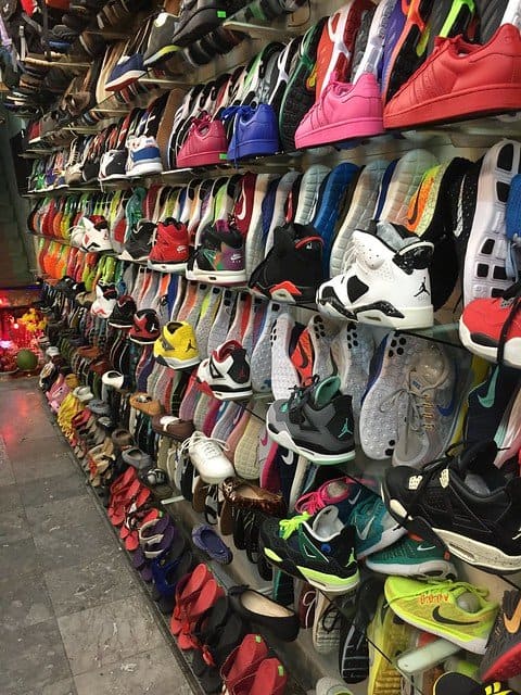 Sneakers displayed for sale on a wall