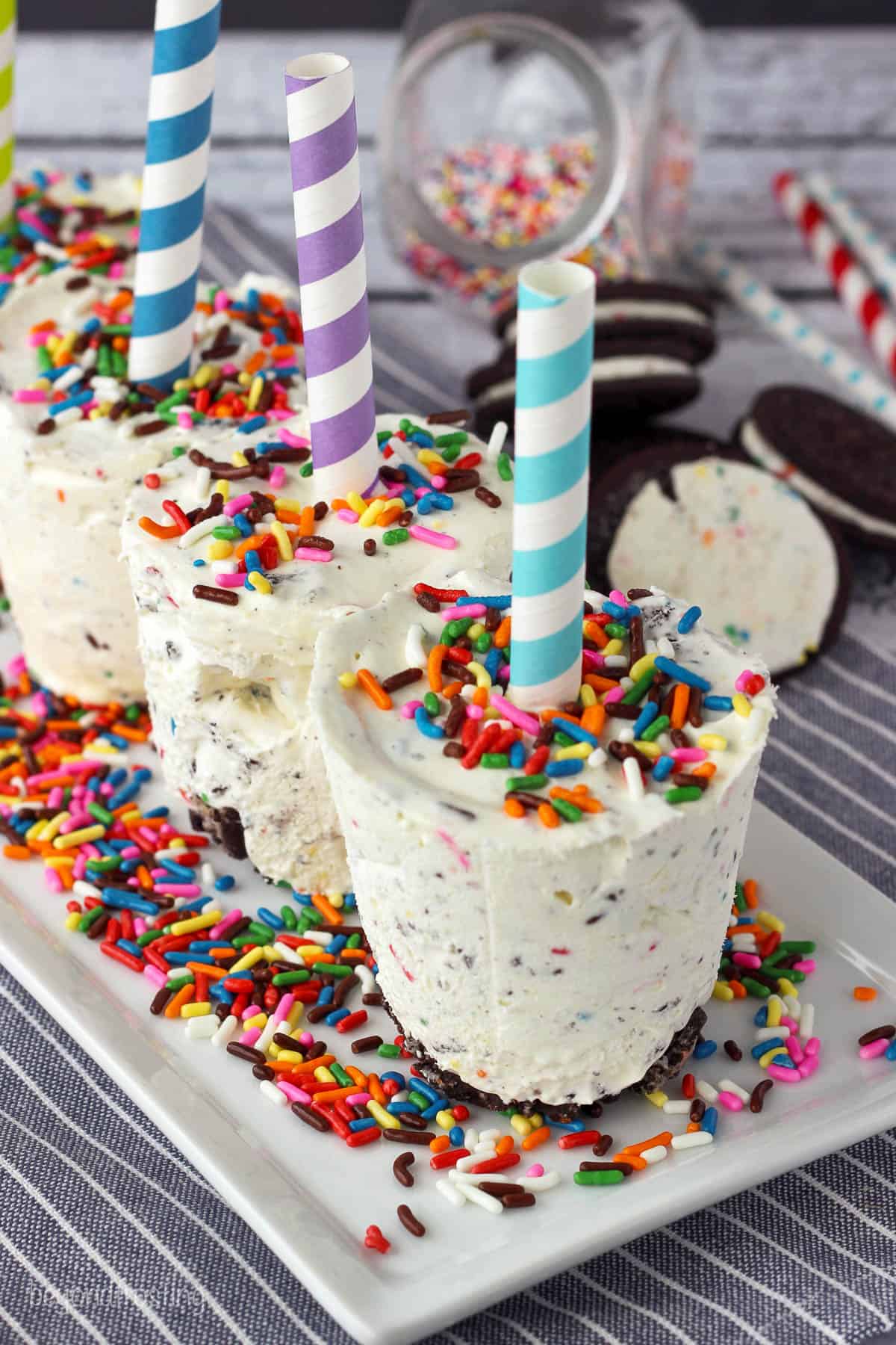 overhead of ice cream pops set upside down on a plate garnished with sprinkles