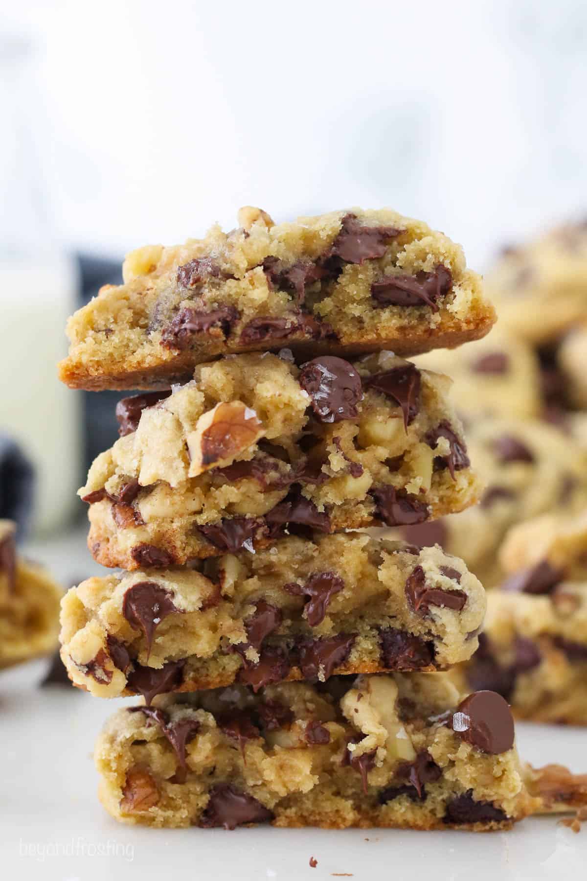 Thick chocolate chip walnut cookies stacked on each other