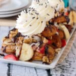 overhead of a plate filled with donut dessert nachos