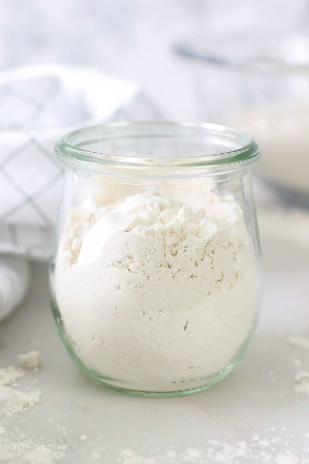 A small glass jar of heat treated flour