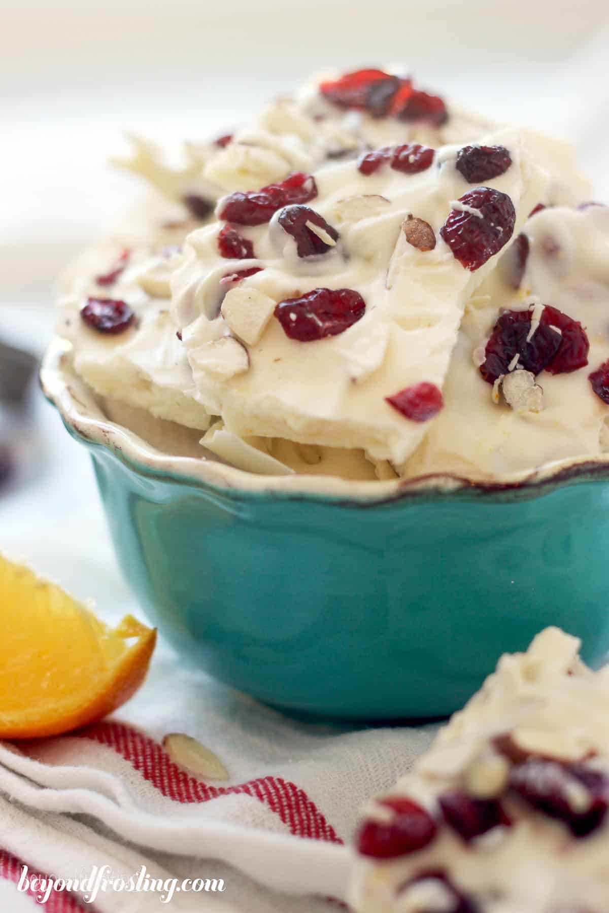 side view of a bowl filled with almond bark