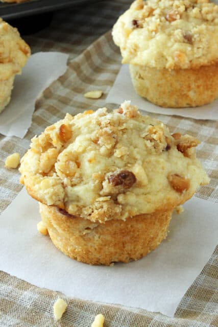 overhead of a peach muffin with other muffins in the background
