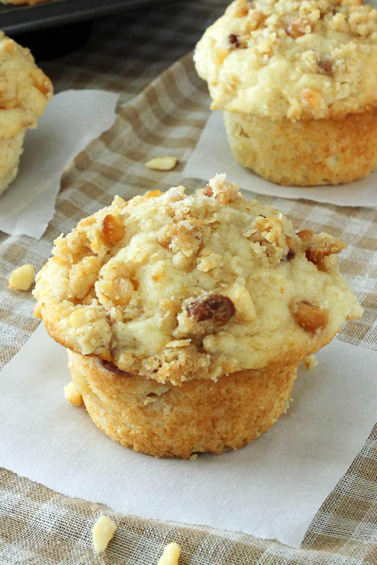 overhead of a peach muffin with other muffins in the background