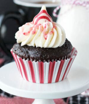 closeup of a peppermint chocolate cupcake on a cupcake stand