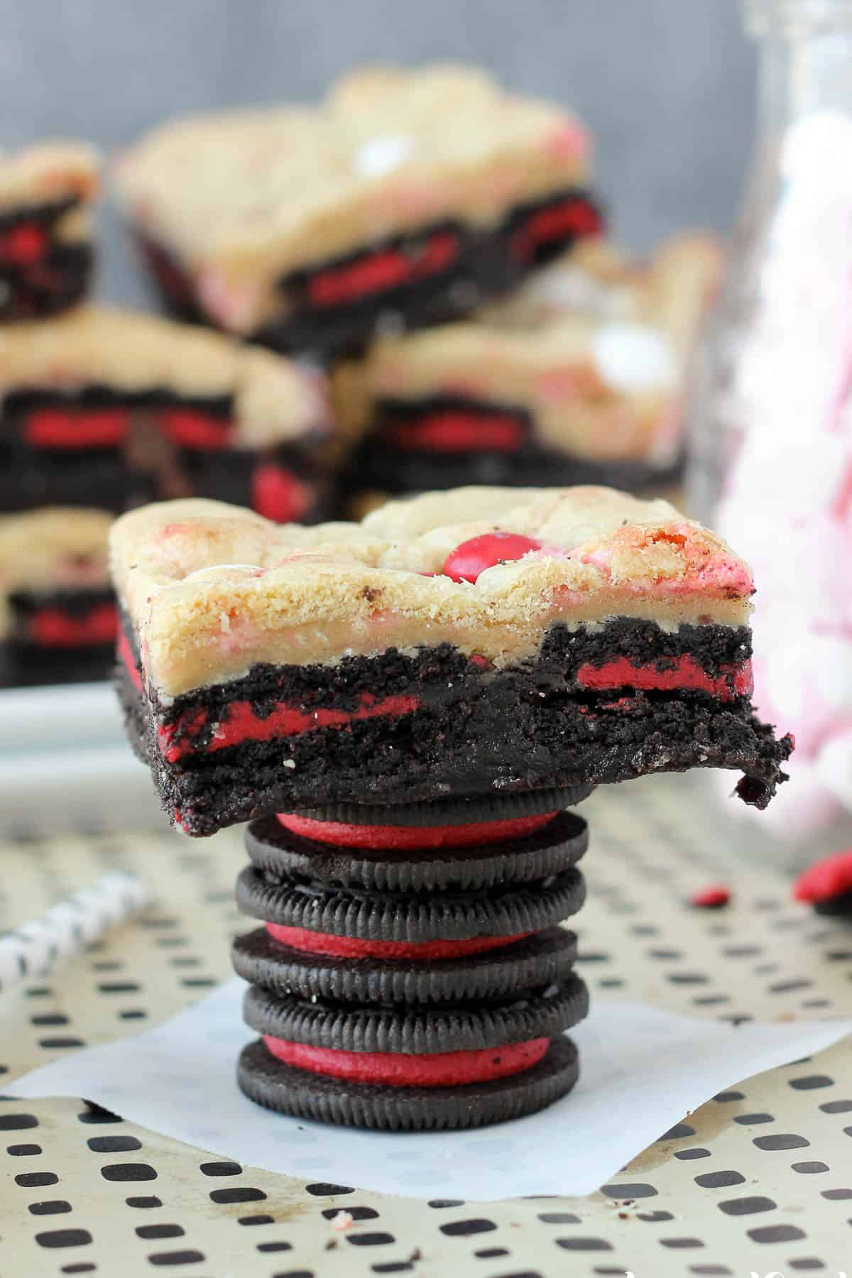 three peppermint Oreos stacked with a peppermint Oreo brookie on top