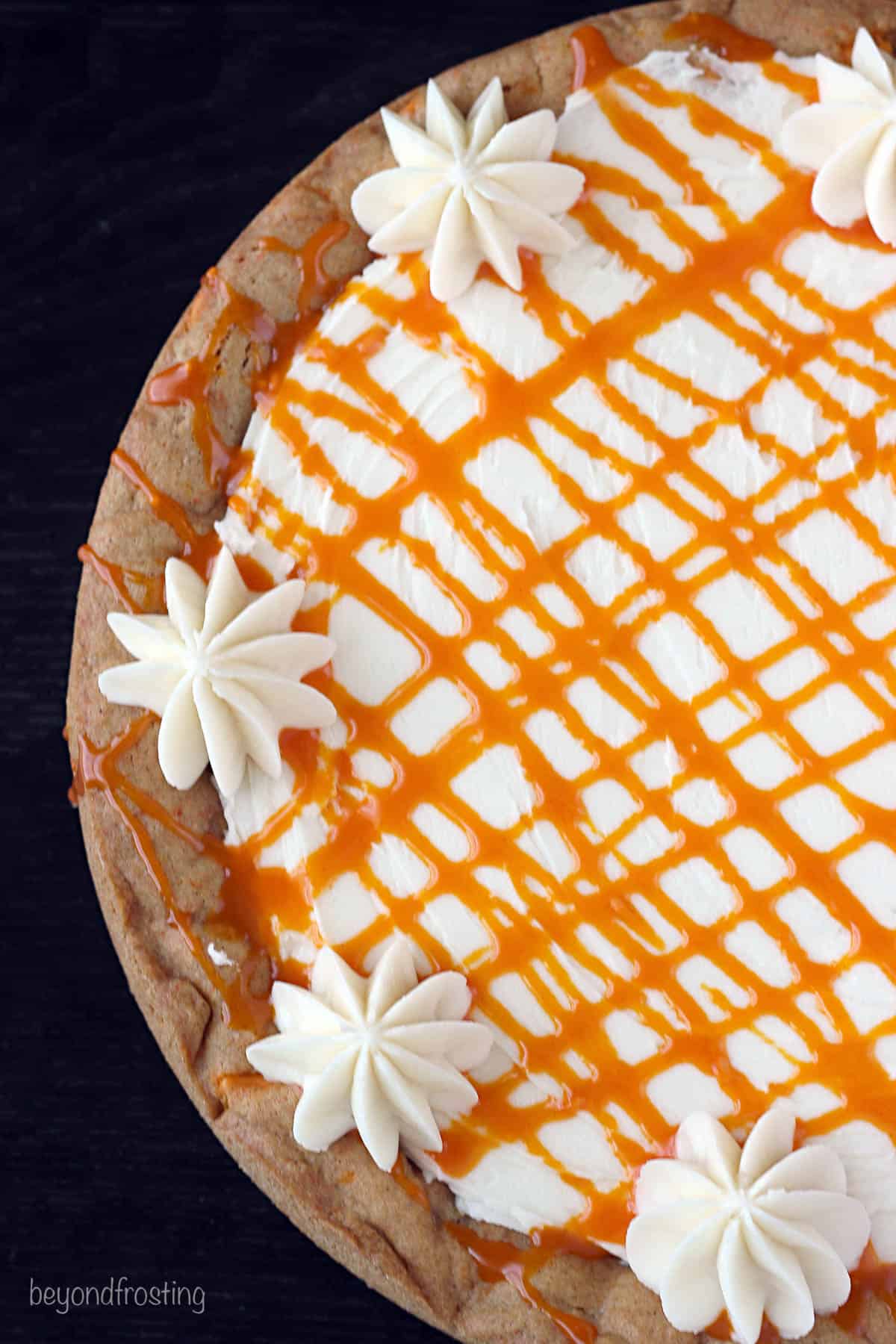 overhead closeup of a whole pumpkin spice cookie cake