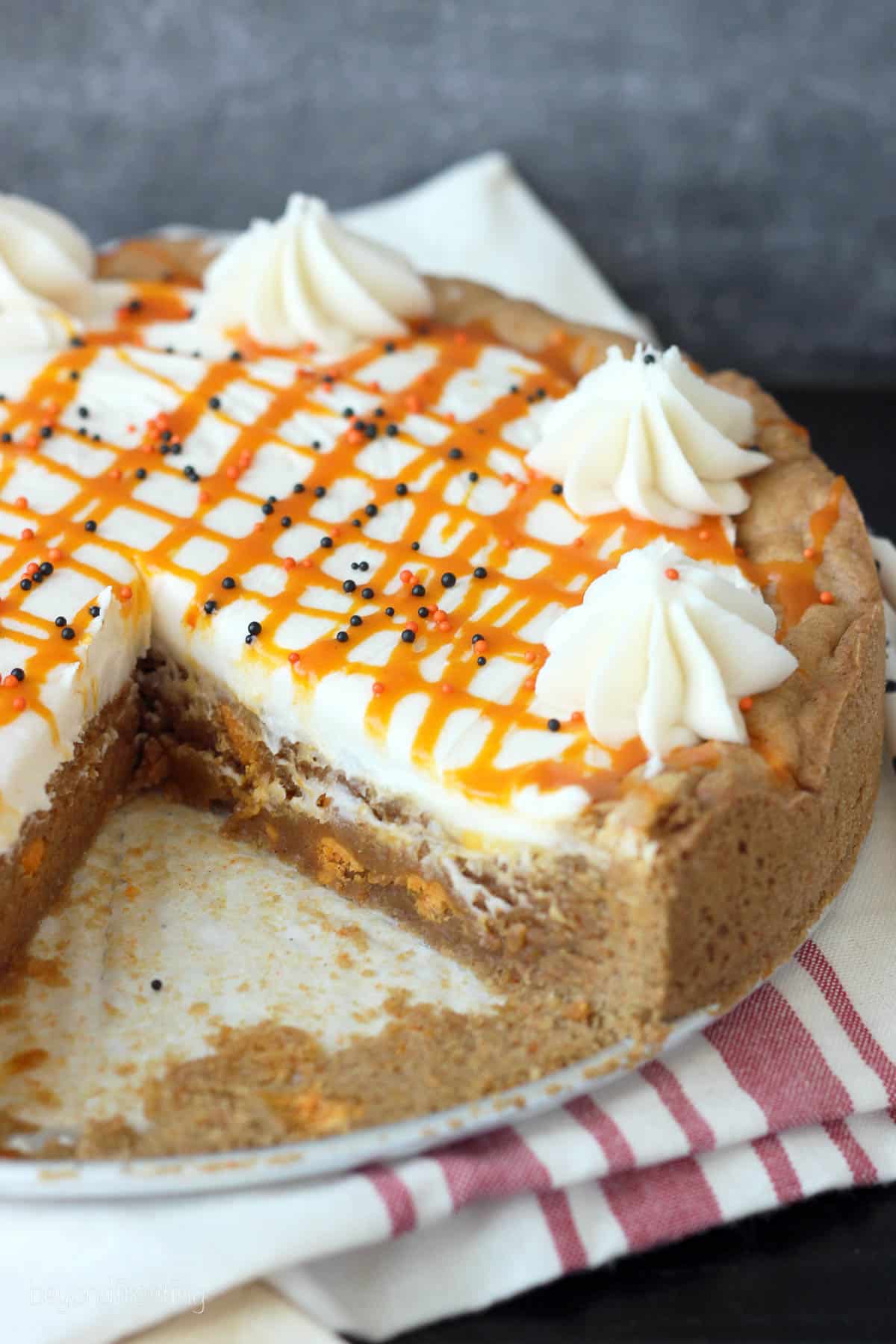 overhead of a pumpkin cookie cake with a slice taken out