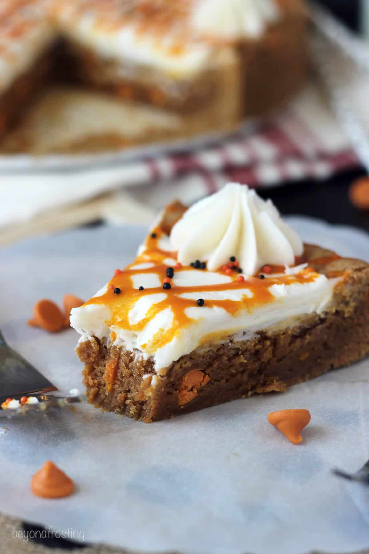 side view of a slice of pumpkin cookie cake with a bite taken out