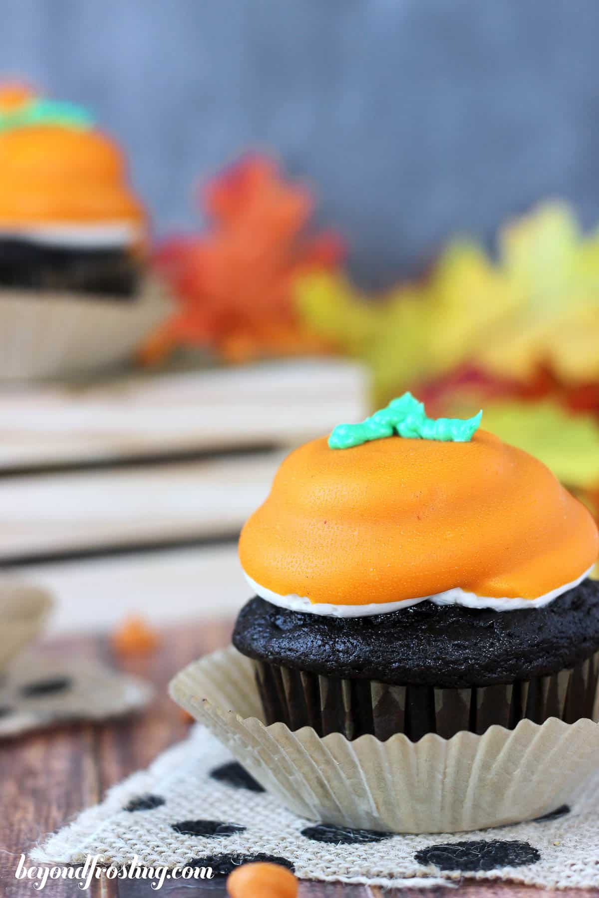 side view of a pumpkin cupcake set in a cupcake wrapper