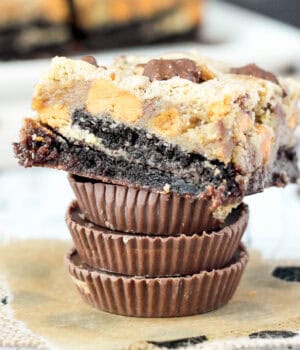 three Reese's peanut butter cups stacked and topped with a peanut butter brookie