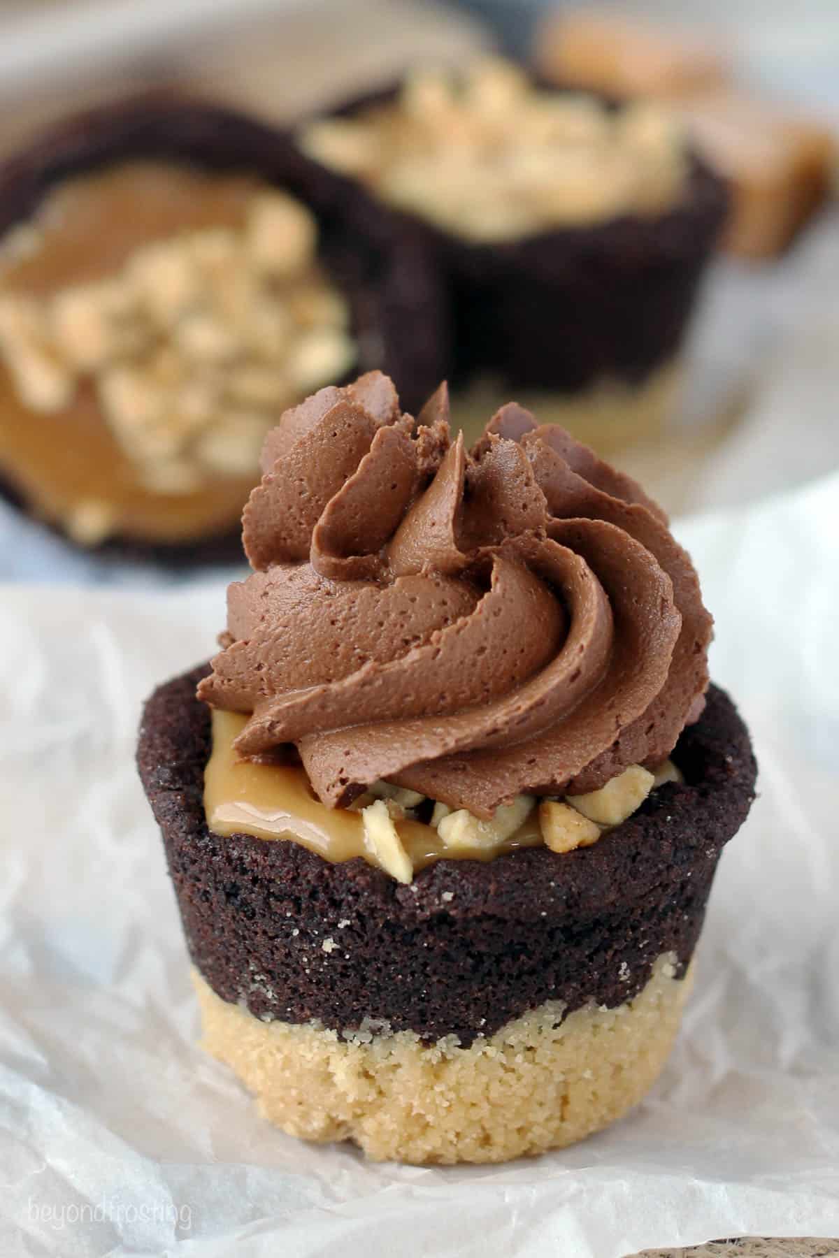 side view of a cookie cup topped with frosting