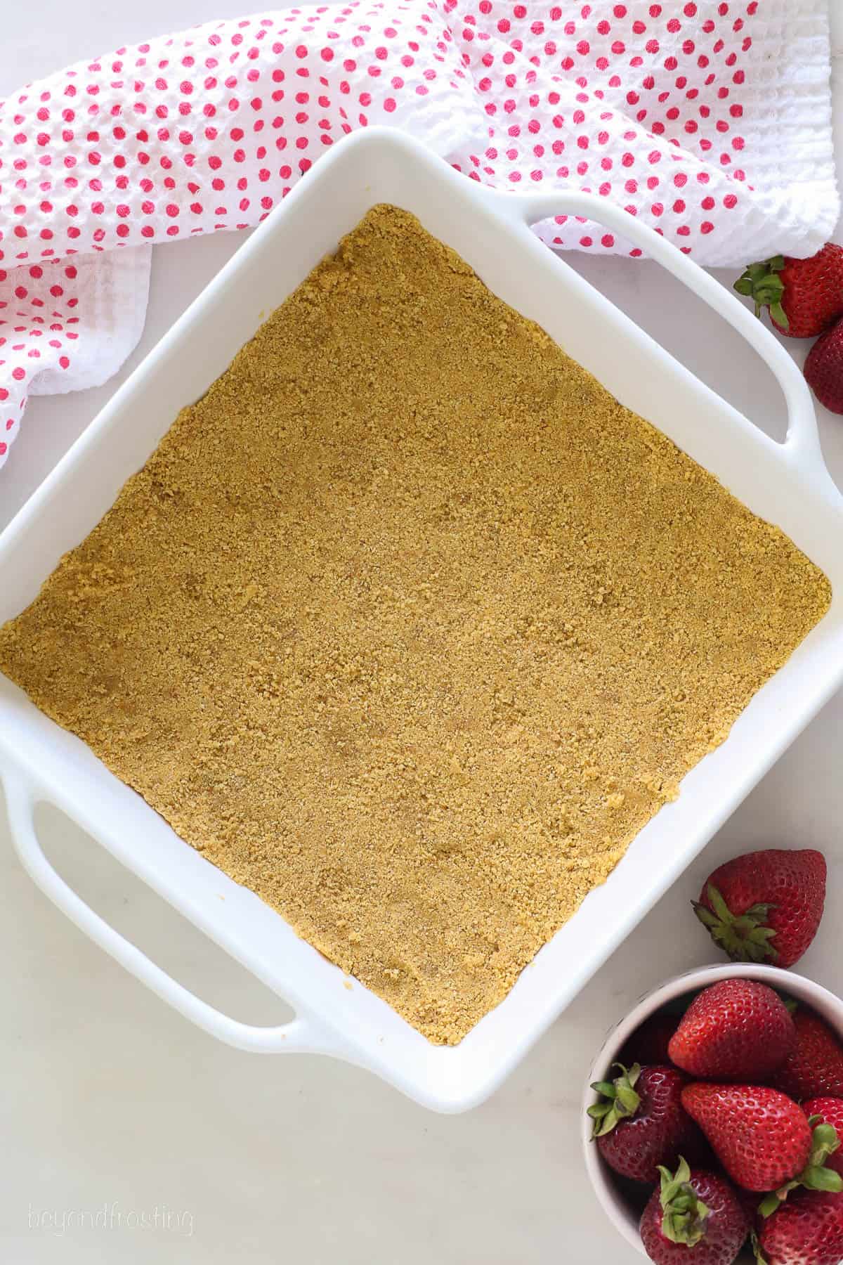 graham cracker crumbs pressed into a white casserole dish