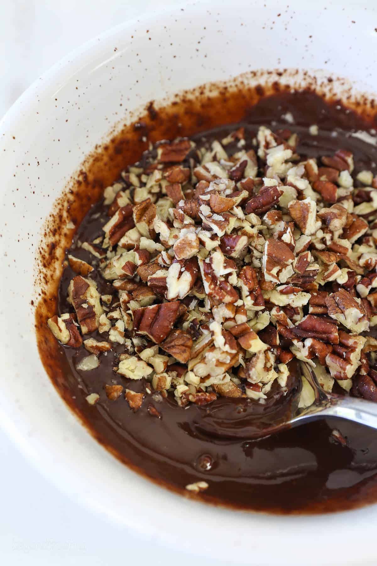 Pecans added with melted chocolate