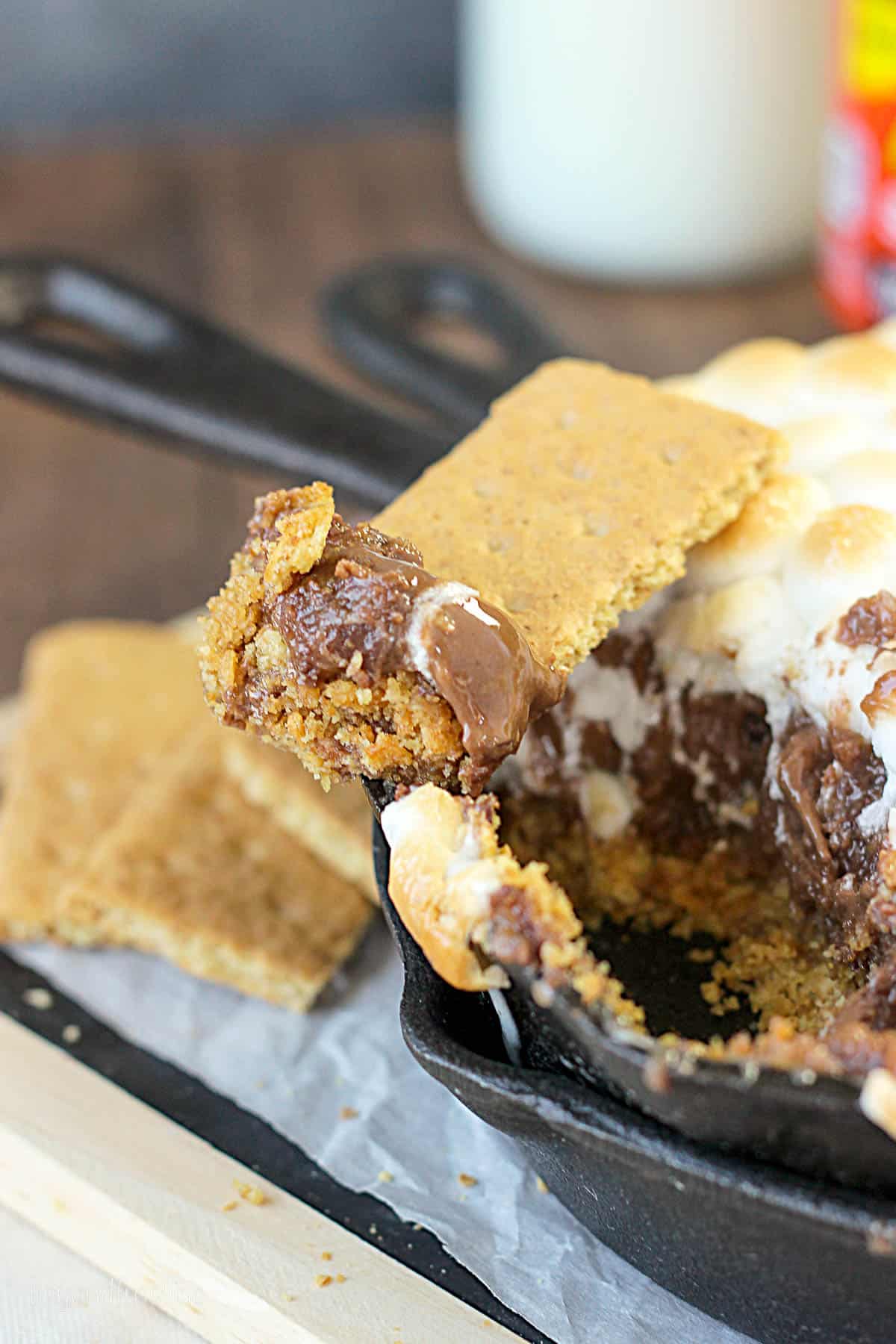 closeup of a graham cracker set on a skillet with peanut butter s'mores dip
