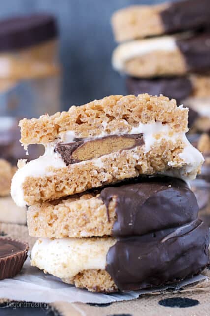 side view of a peanut butter rice krispie treat s'mores with another one on top cut in half